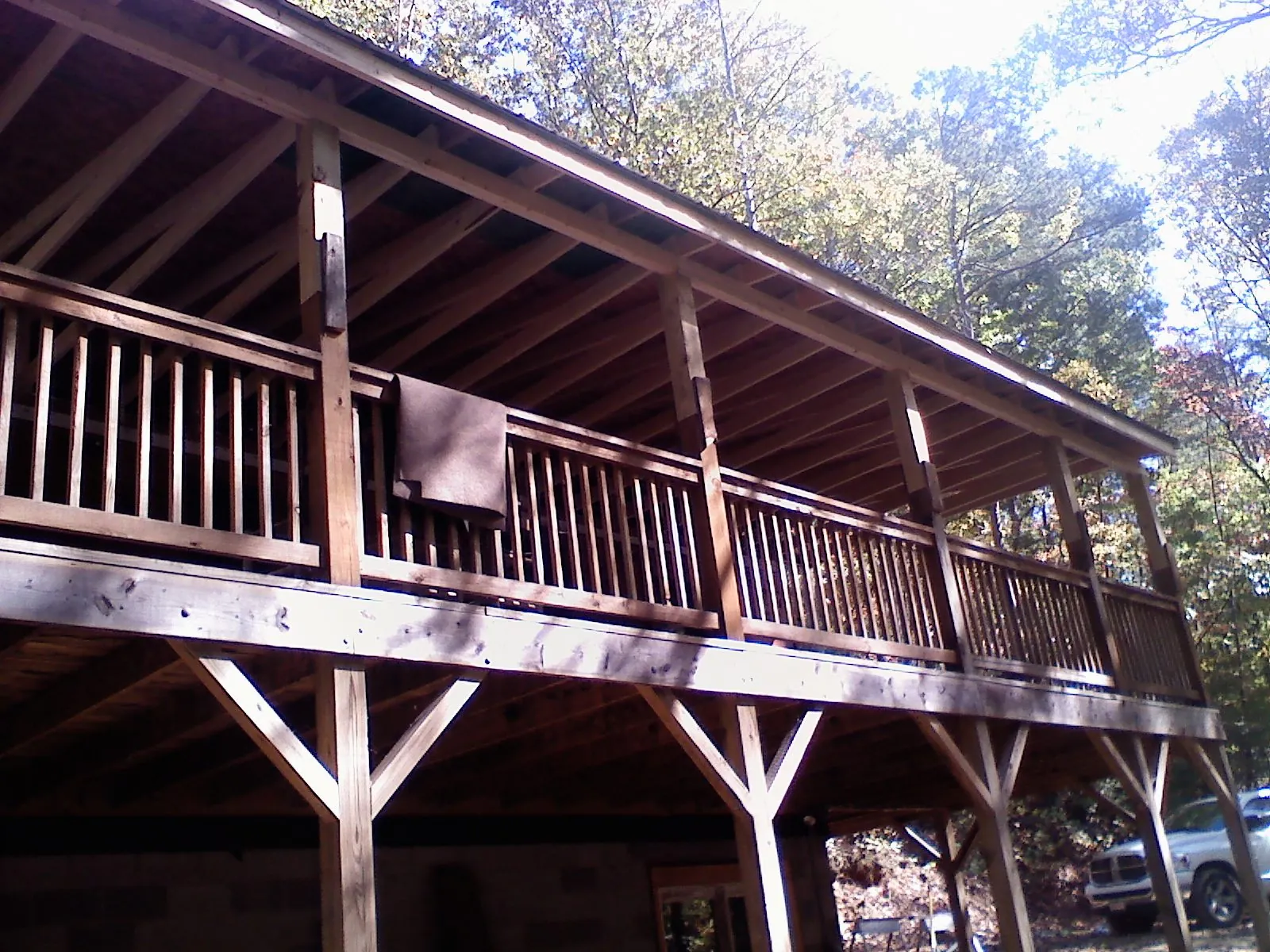 Timber framing under a new elevated porch and deck in Baldwin